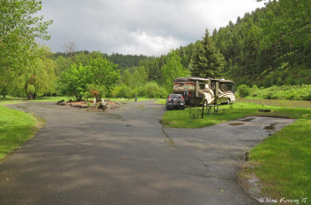 View of end of camping loop. Empty site on right #14, we're in #15, #16-#18 are around the back of the loop.