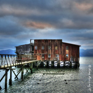 Dramatic sunset over an old cannery building