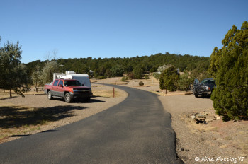 View of end of 1st loop. Camper in site #23 on left. Site #22 on right.