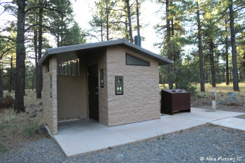 View of facilities (pit toilets). Multiple of these around each camping loop.