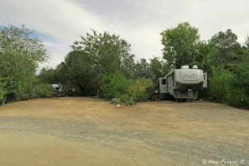 View near end of "upper park" loop. RV in site #80 with empty site #81 beside it. These were both large sites.