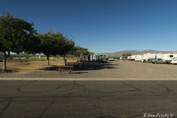 View down front row on north side of entrance street. Site #13 in front with #14-#19 behind. Middle row on the right.