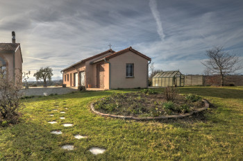 View of the garage and green house