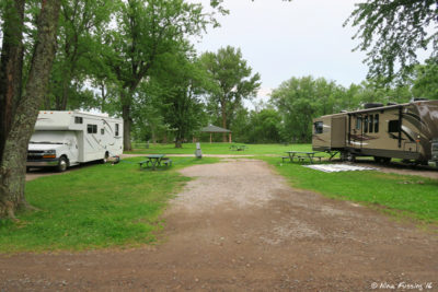 View of full hookup sites by the entrance. Site #2 on right, empty site #3 in middle, site #4 on left.
