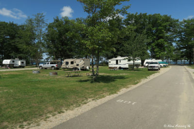 View towards lake end of loop 77-121. Site 108 on left with 106 behind it.
