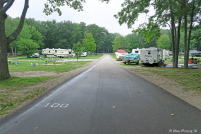 View from lake end of loop 77-121. Site 100 on left, Rig in site 102 on right.