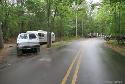 Entrance to loop 1. Pull-through site 145 on left with truck in site 101 on right.