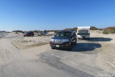 View down F loop. Camper in F17 with F16 behind it.