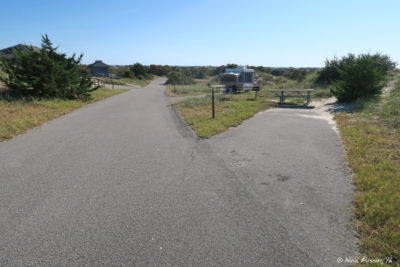 View down small, uneven sites in E loop (no way we could fit here). Site E5 on right with pop-up in E3 behind it.